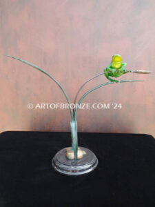 Hangn out tree frog sitting on cattail bronze statue
