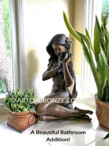 Illusion bronze sculpture of exotic nude woman listening to shell for private gallery or public display