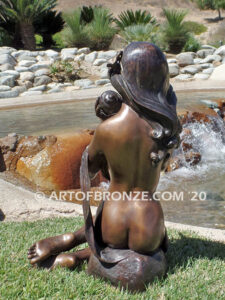 Illusion bronze sculpture of exotic nude woman listening to shell for private gallery or public display