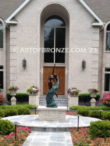 Inspirare beautiful woman leaping upward with spiraling wave design around her bronze statue