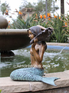 Bronze mermaid sculpture holding oyster shell for pond, pool or aquatic display