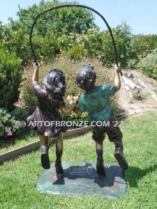 Jump Rope outdoor large bronze sculpture of girl and boy jumping rope