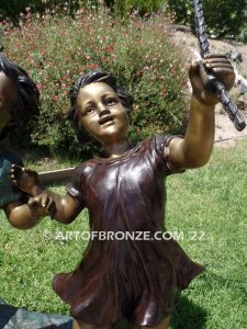 Jump Rope outdoor large bronze sculpture of girl and boy jumping rope