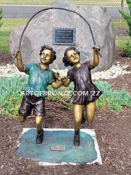 Jump Rope outdoor large bronze sculpture of girl and boy jumping rope