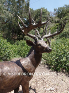 King of the Forest bronze buck sculpture of standing white-tailed deer outdoor monument