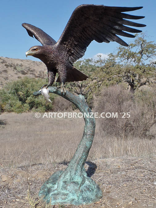 Lake Rights bronze sculpture of eagle landing on branch with fish