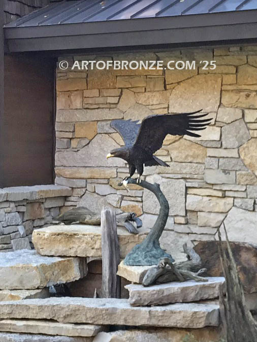 Lake Rights bronze sculpture of eagle landing on branch with fish