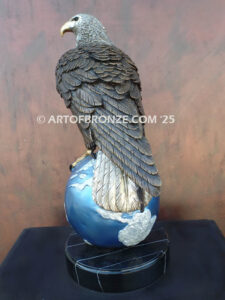 Limited edition bronze statue of bald eagle perched on globe