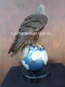 Limited edition bronze statue of bald eagle perched on globe