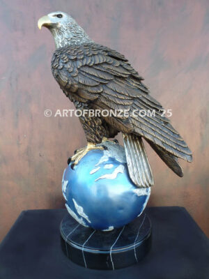 Limited edition bronze statue of bald eagle perched on globe
