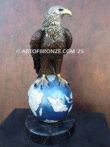 Limited edition bronze statue of bald eagle perched on globe