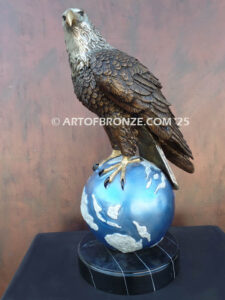 Limited edition bronze statue of bald eagle perched on globe