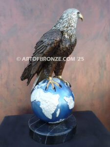 Limited edition bronze statue of bald eagle perched on globe