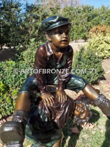 Leapfrog bronze sculpture of boy jumping over his brother