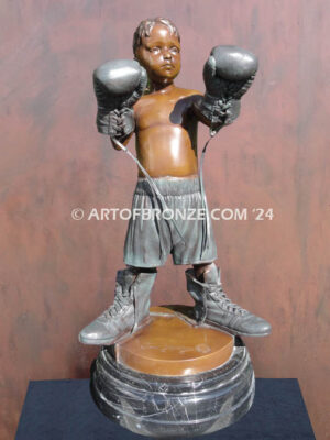 Lil Big Gloves bronze sculpture of boxing boy wearing his dads gear