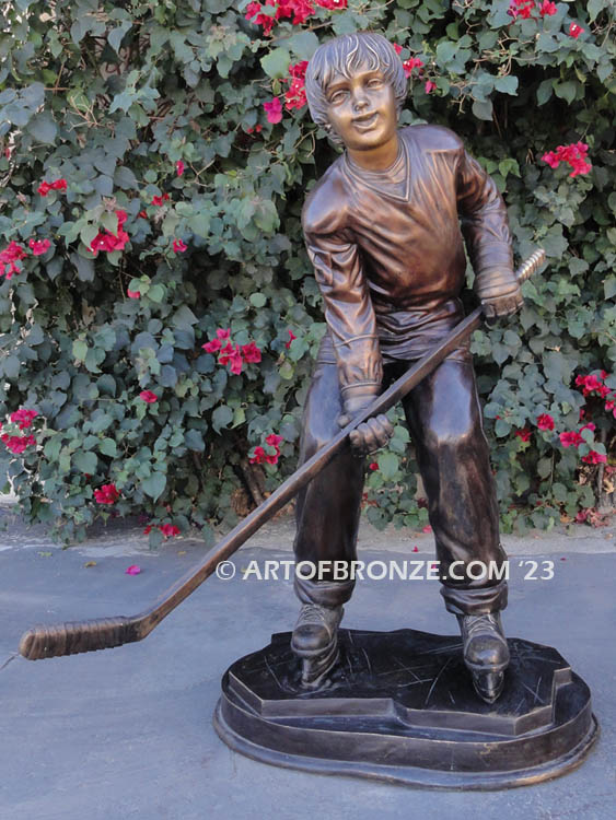 Lil Playmaker bronze sculpture of boy playing hockey