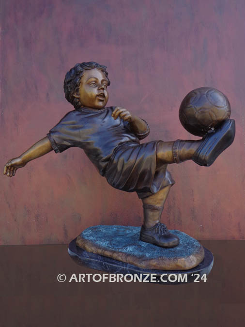 Lil Scorer bronze sculpture of boy playing AYSO soccer bicycle kicking ball