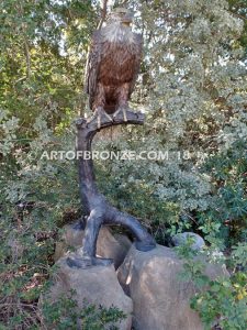 Lone Sentinel bronze sculpture of eagle resting on branch monument for public art or veterans memorial