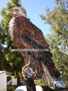 Lone Sentinel bronze sculpture of eagle resting on branch monument for public art or veterans memorial