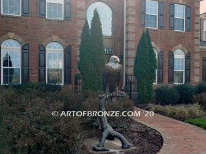 Lone Sentinel bronze sculpture of eagle resting on branch monument for public art or veterans memorial