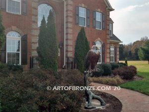 Lone Sentinel bronze sculpture of eagle resting on branch monument for public art or veterans memorial