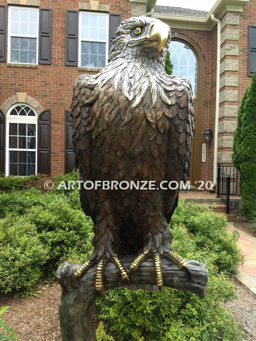 Lone Sentinel bronze sculpture of eagle resting on branch monument for public art or veterans memorial