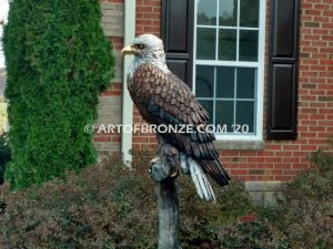 Lone Sentinel bronze sculpture of eagle resting on branch monument for public art or veterans memorial