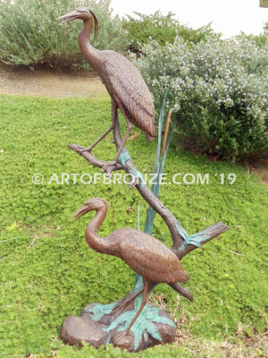 Mashland Waders lost wax casting of two heron cranes resting on branch at tranquil residence