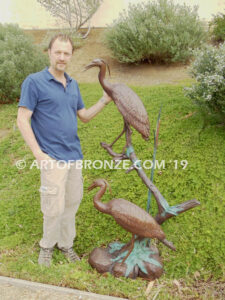 Mashland Waders lost wax casting of two heron cranes resting on branch at tranquil residence