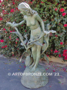 Nouveau composition monumental outdoor bronze statue of beautiful nude female standing with flowers