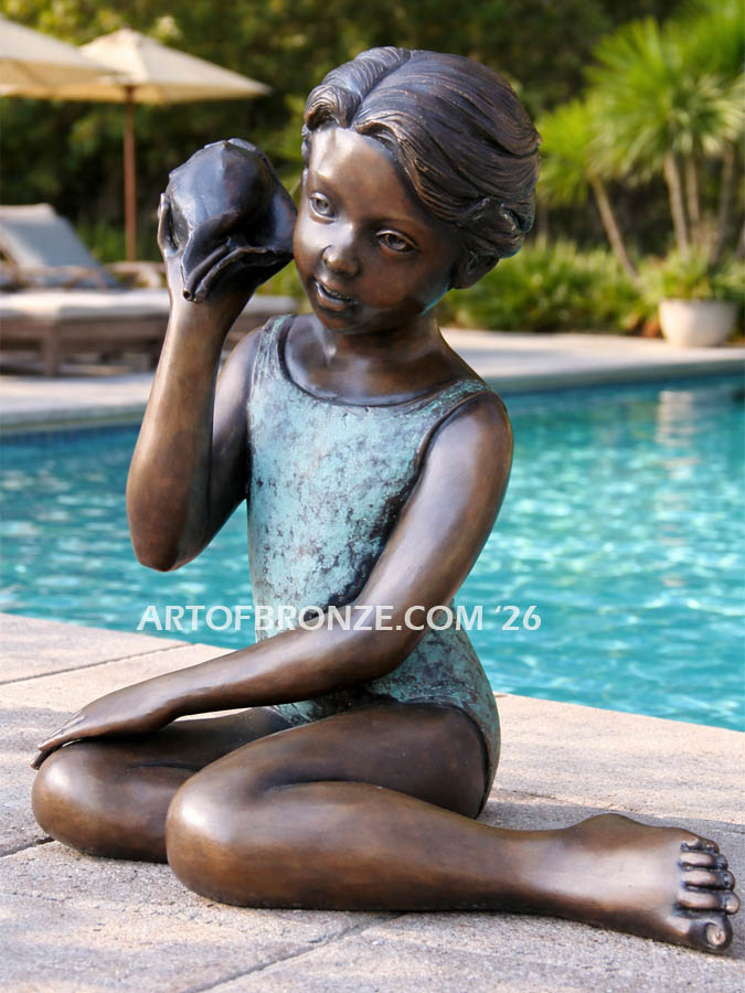 Ocean Sounds bronze statue bathing suit girl holding conch shell to her ear