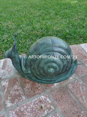 On the Move bronze snail sculpture artwork for outdoor garden or indoor display