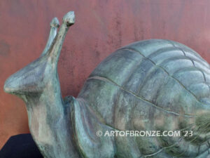 On the Move bronze snail sculpture artwork for outdoor garden or indoor display