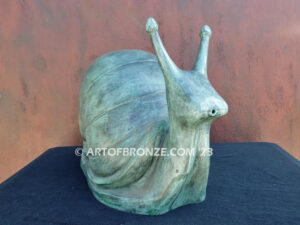 On the Move bronze snail sculpture artwork for outdoor garden or indoor display