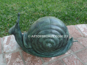 On the Move bronze snail sculpture artwork for outdoor garden or indoor display