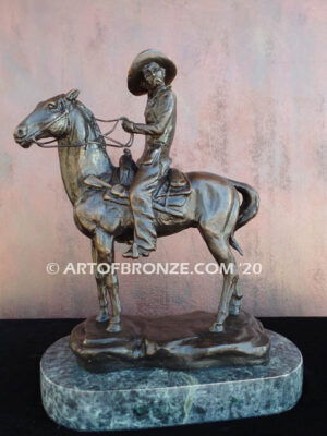 On the Range bronze sculpture of western cowboy on cattle horse