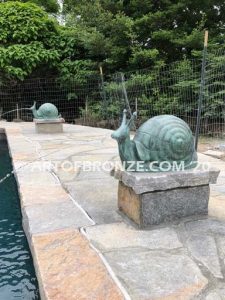 On the Move bronze snail artwork for outdoor garden or indoor display