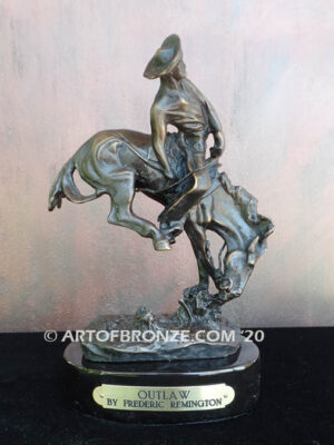 Outlaw bronze statue cowboy on bucking horse after Frederic Remington