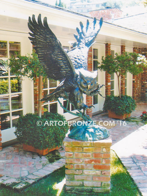 Owl lost wax bronze casting of magnificent and powerful owl hunting on brick pedestal