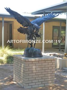 Owl lost wax casting of magnificent and powerful owl hunting on brick pedestal