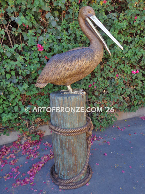 Pelican Perch bronze sculpture of pelican standing on bronze piling