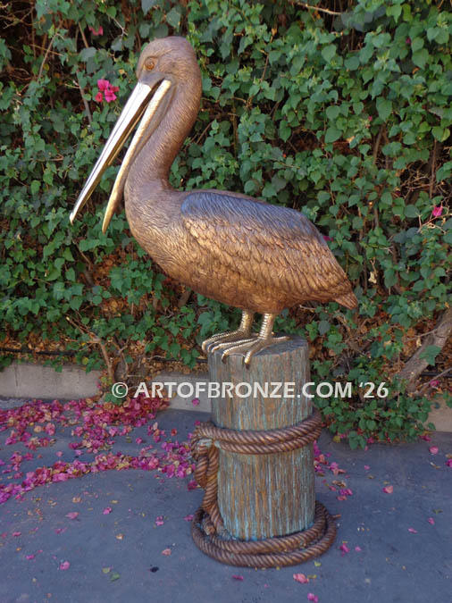 Pelican Perch bronze sculpture of pelican standing on bronze piling