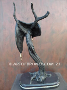 Persistence of Memory Salvador Dali inspired bronze statue of melting watches and clocks