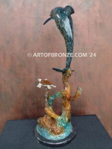 Play Pals dolphin leaping above sea turtle bronze statue