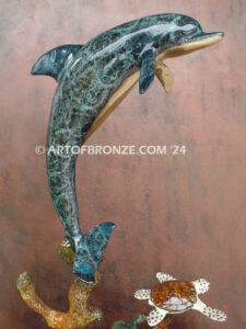 Play Pals dolphin leaping above sea turtle bronze statue