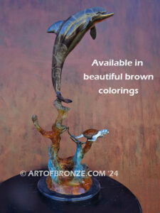 Play Pals dolphin leaping above sea turtle bronze statue
