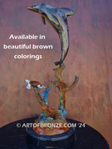 Play Pals dolphin leaping above sea turtle bronze statue