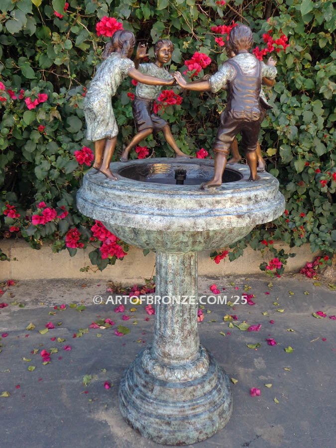 Playground Joy bronze fountain sculpture of kids dancing around