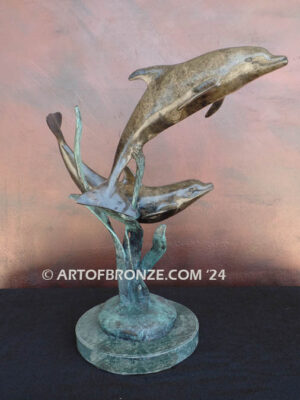 Playmates two dolphins playfully swimming together bronze statue