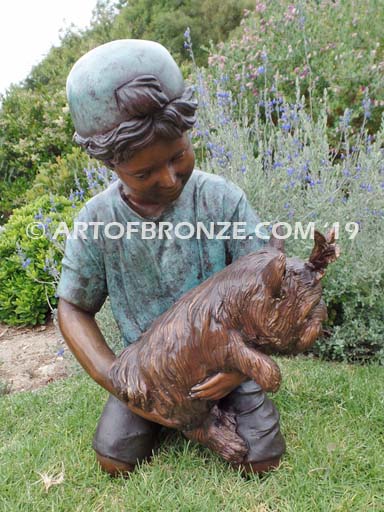 Play Pal bronze sculpture of young boy holding his dog